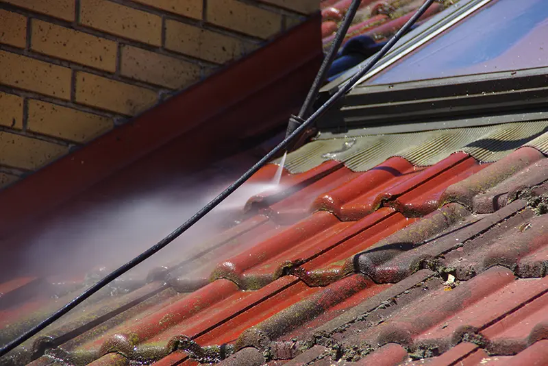 Pressure washing a roof